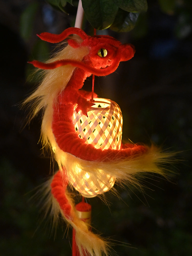 Chinese dragon climbing onto bamboo lanterns with LED